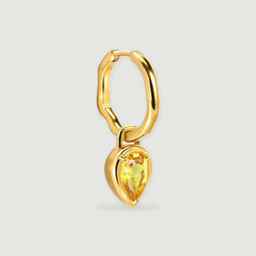 An angled yellow gold plated hoop reveals its hinged closure and hanging pear-shaped citrine drop.