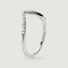 An upright white gold ring reveals the slim band, raised diamond settings, and inner 14k hallmark.