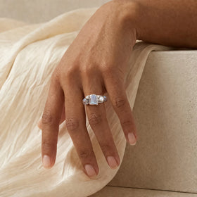 Tidal Bloom moonstone pearl cluster ring, sterling silver, shown on hand with linen