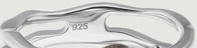 The back of the silver ring shows curved openwork, a polished inner band, and a 925 purity stamp.