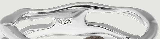 The back of the silver ring shows curved openwork, a polished inner band, and a 925 purity stamp.