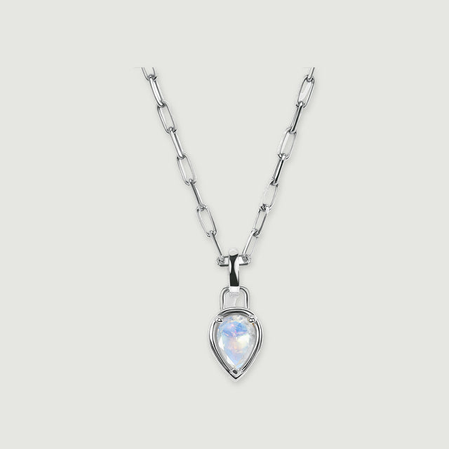 A silver-tone elongated-link necklace with a pear-shaped moonstone pendant is centered on light gray with a soft shadow.
