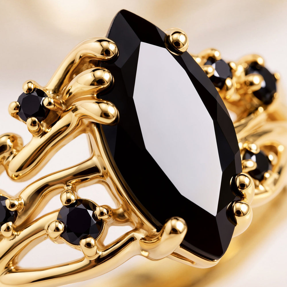 A close view shows the faceted black center stone held by rounded yellow gold prongs.