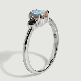 A side view reveals the raised stone settings and polished sterling silver band with a 925 hallmark.