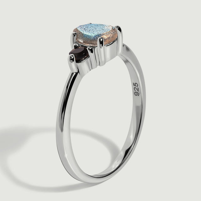 A side view reveals the raised stone settings and polished sterling silver band with a 925 hallmark.