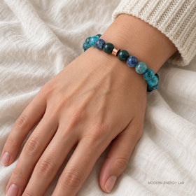 Blue-green natural stone bracelet worn with an ivory knit sleeve