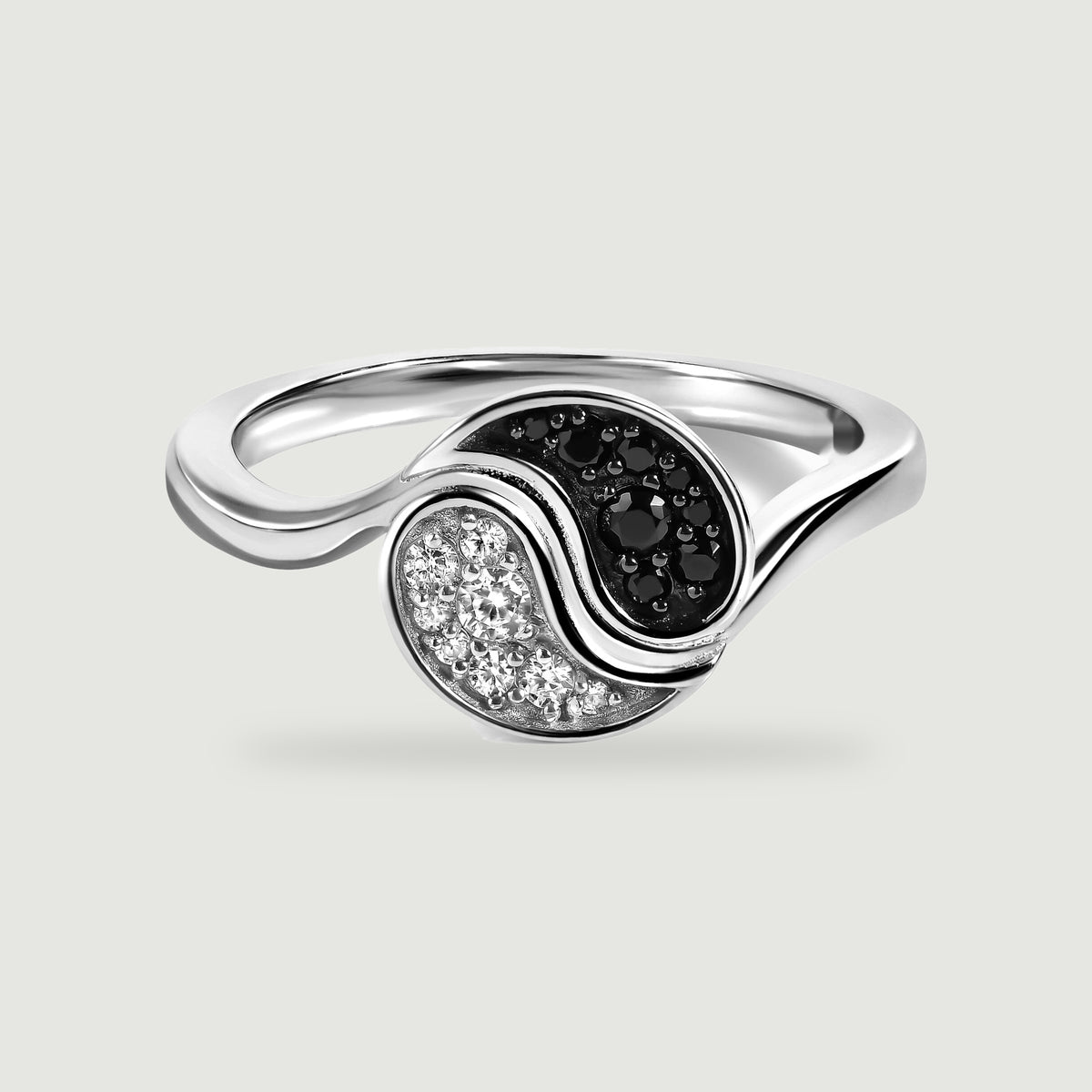 A rhodium plated ring shows a polished curved band and contrasting black and clear stones on light grey.