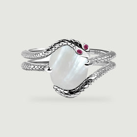 A silver wrap ring shows a pearly oval center framed by textured bands on a light gray surface.