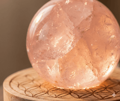 The Radiant Heart: Glowing Rose Quartz Sphere Lamp with 'Flower of Life' Base - ModernEnergyLab.com